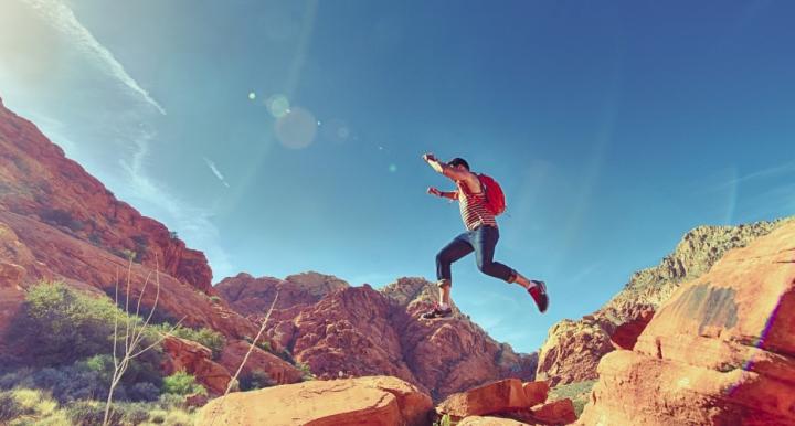 Man Jumping Boulders Joyfully